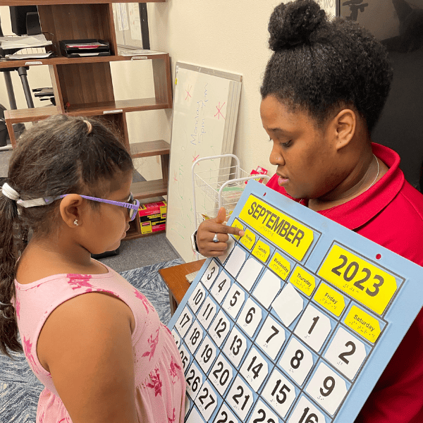 A student learns how to read a calendar.